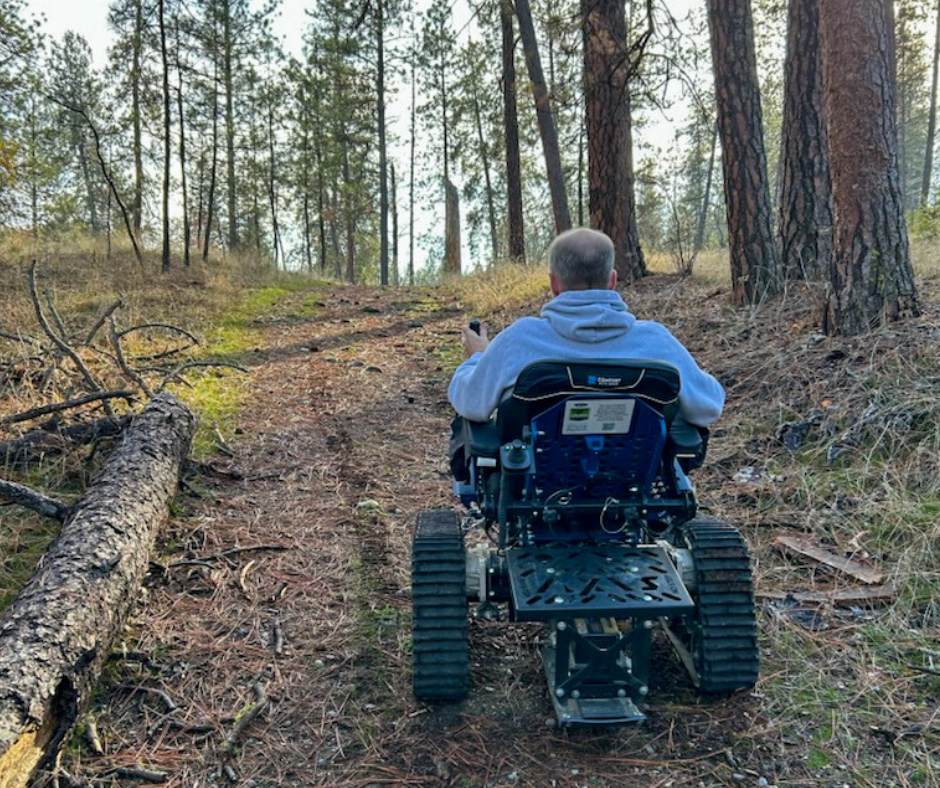Back of the Action Trackchair at Riverside State Park riding up a hill