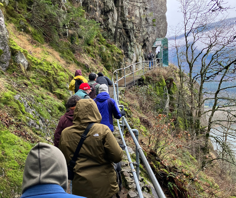 Group of people participating at the First Day Hike at Beacon Rock on one of the switch back trails overlooking the Columbia River