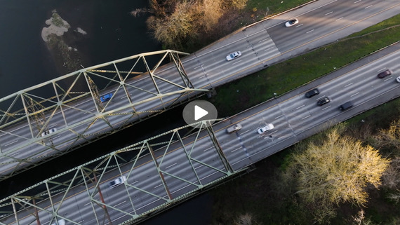 Overhead shot of I-5 bridge at Nisqually River with play button