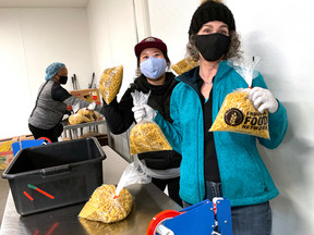 photo of people repacking pasta