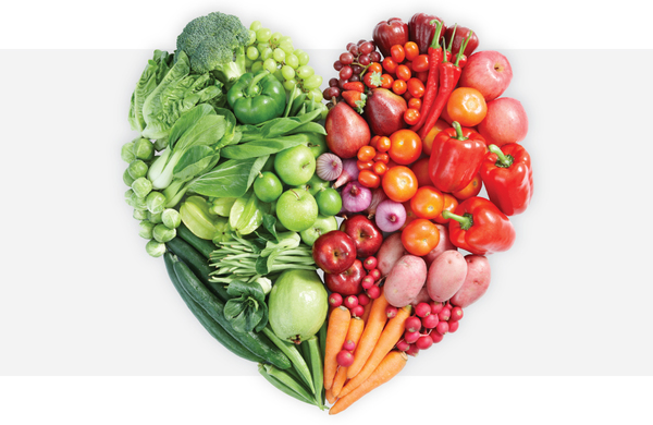 Fruits and vegetables forming the shape of a heart