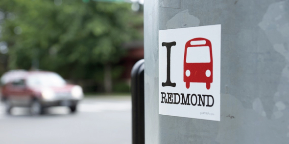 Sticker on light pole that says I bus Redmond