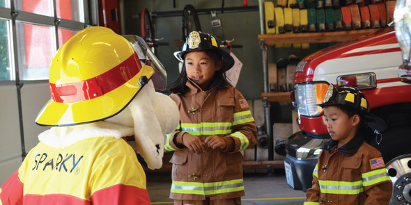 Kids playing with Sparky the dog