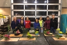 Students in class showing flower arrangements
