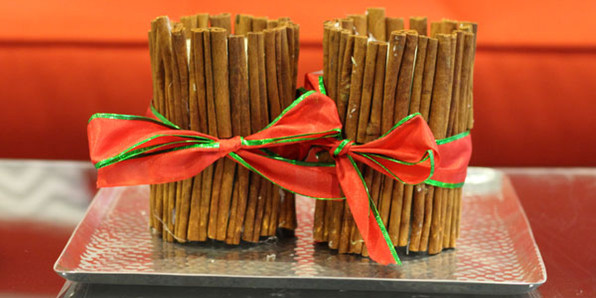 Old candles wrapped in cinnamon sticks