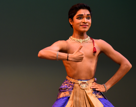 Performer, Akhilesh “Akhi” Vadari, dancing on stage.