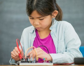 Child working with electronics