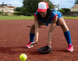 Woman fielding a softball