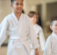 Young children in a martial arts gym
