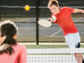 Teens playing pickleball