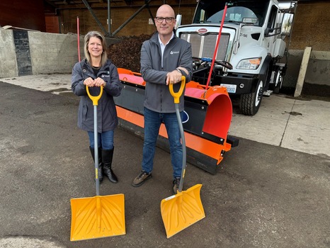 Redmond Mayor Angela Birney and Public Works Director Aaron Bert with snow shovels