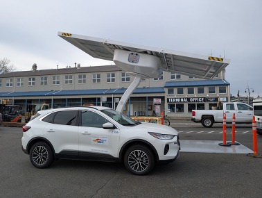 a fleet vehicle charging at the new solar charger at fisherman's terminal