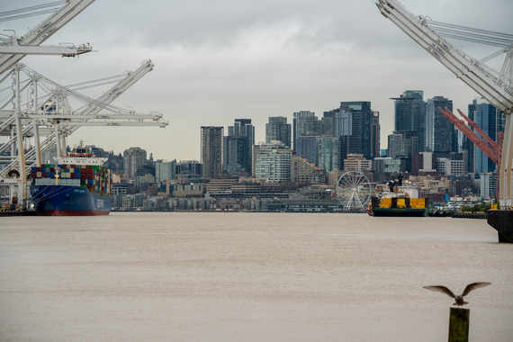 vessels at terminal 18 on seattle on a cloudy day with the city in the background