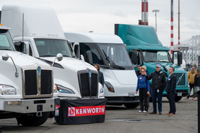 a series of zero emission trucks on a port termial