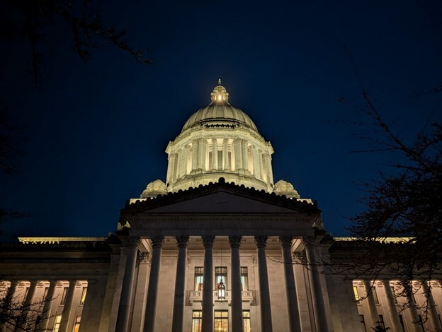 The Washington state capitol dome lit up in the pre-dawn light. 