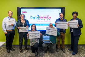 Group of Seattle IT employees holding digital equity signs