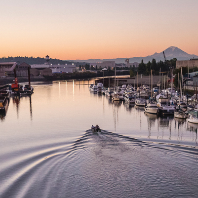 boat on the Duwamish River with Mt Rainier in the distance