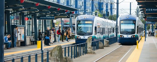 Sound Transit Link Light Rail sitting at a platform waiting to pick passengers up.