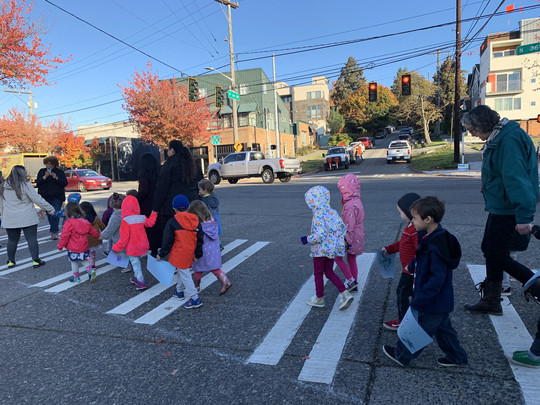 Preschool students cross the street at a newly-installed metered crossing in Fremont