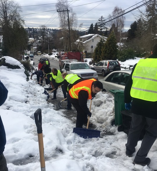 Senior Deputy Mayor Fong and members of Mayor Durkan's cabinet shovel snow as part of 2019's Shared Shovel campaign.