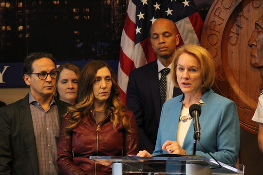 Mayor Durkan stands with a community members and a family impacted by a fentanyl-related overdose