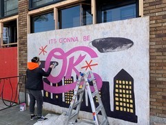 Artist painting a mural