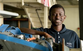 Black mechanic posing