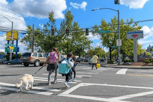 People walking along Rainier Ave S.