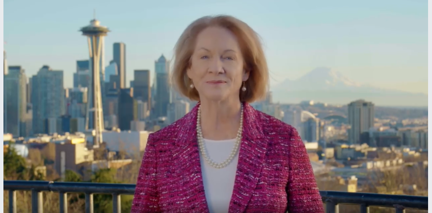 Mayor Durkan gives a New Years Eve message, with the Seattle skyline behind her