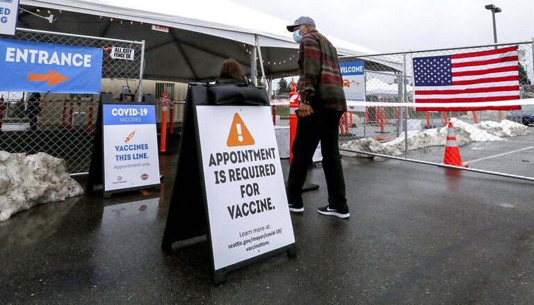 Seattle resident waits in line for COVID Vaccine