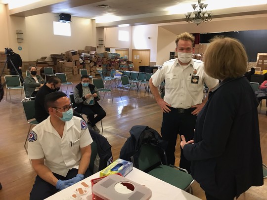 Mayor Durkan speaking with members of the SFD mobile vaccination team