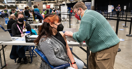 Seattleite getting a COVID-19 vaccination