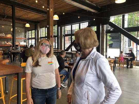 Mayor Durkan speaks with resident at Optimism Brewing in Capitol Hill