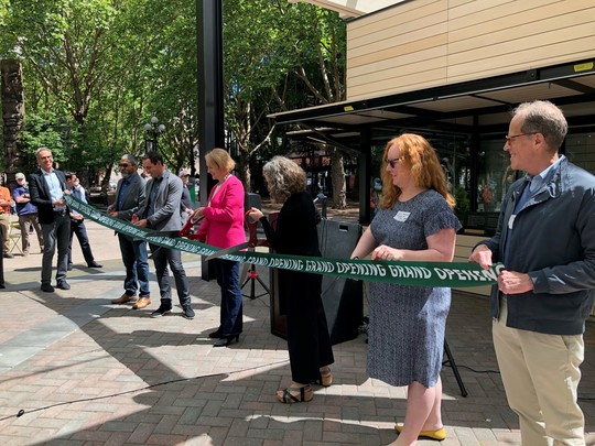 Mayor Durkan cuts the ribbon at the Occidental Square Pavilion grand opening