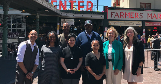 Mayor Durkan with community leaders at Pike Place Market