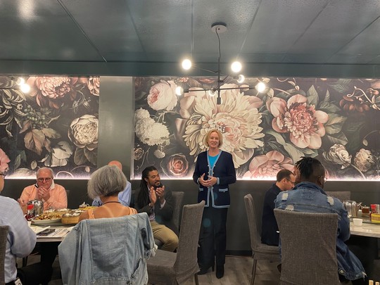 Mayor Durkan speaking to her cabinet and community members during lunch