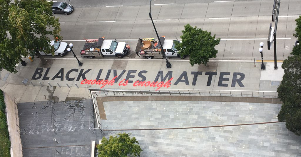 Sidewalk installation that reads ?Black Lives Matter, Enough is Enough,? on 4th Ave between Cherry St. and James St. 