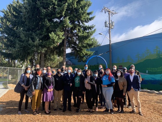 Mayor Durkan poses with a large group at Duwamish Waterway Park
