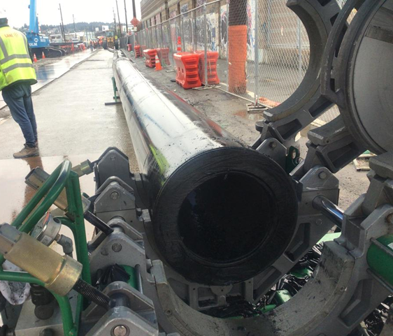 Temporary water bypass pipe in East Ballard. Pipe segments are moved into the area separately and fused together at the site to build one long pipe. 