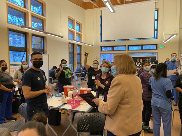 Mayor Durkan with healthcare providers at a booster clinic