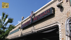 The storefront of a shop named Coffee Messiah with a logo that says "Seattle Histories" in the top corner