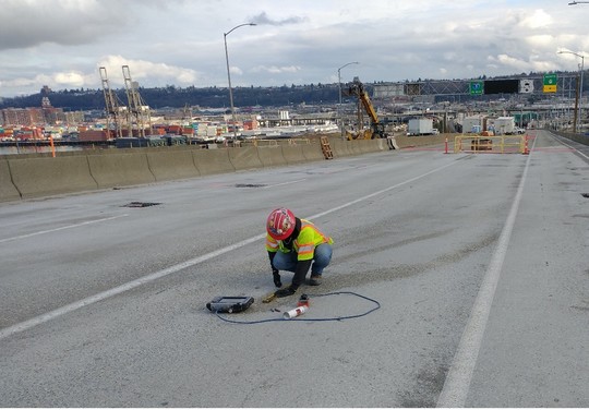 Crews use ground penetrating radar (GPR) scanners to locate rebar in the concrete before drilling. 