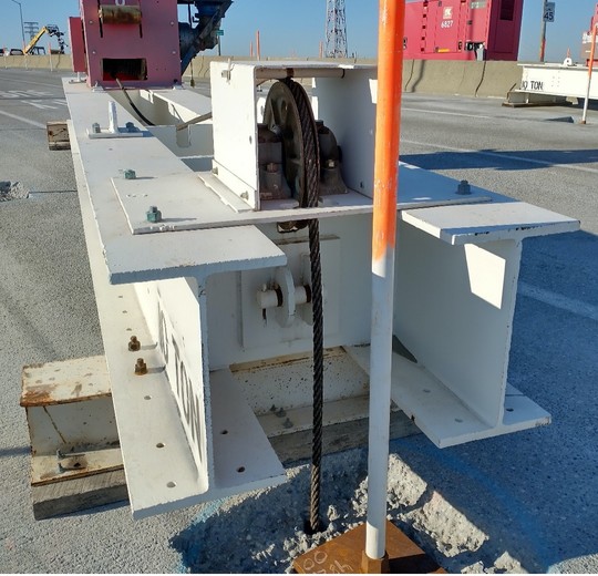 Winches are used to hoist the work platforms with the cable running through an opening on the bridge deck that we cut last month.
