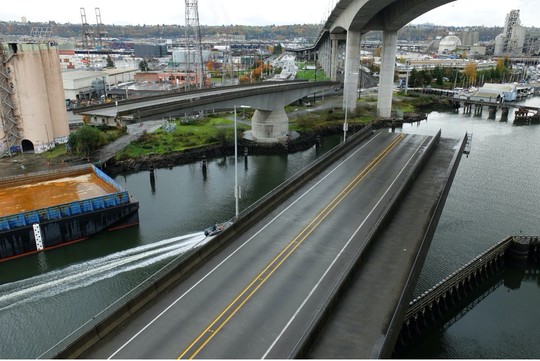 The Spokane St Swing Bridge (low bridge) swings open for maritime traffic.