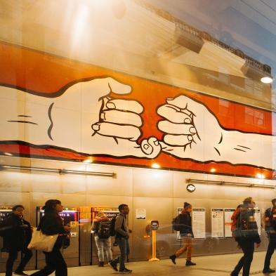 Public Art at Capitol Hill Light Rail Station depicting two large hands doing a pinky swear.