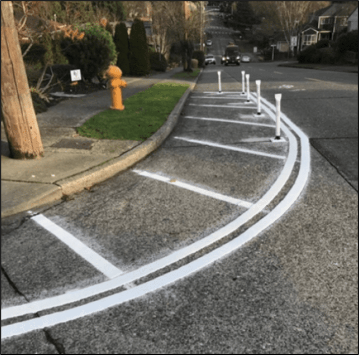 Paint and post curb extensions were installed in various areas of West Seattle.