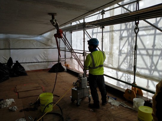 On the work platforms, we use a pump to inject cracks with an epoxy compound ahead of applying carbon-fiber wrap to the bridge’s exterior.