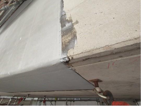 After filling cracks with epoxy, we apply carbon-fiber wrap to sections of the bridge. 