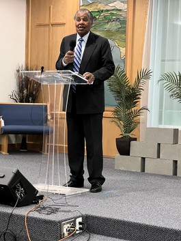 Retired Fire Chief Claude Harris speaks after being recognized with an MLK Commemorative Committee award
