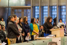 Immigrant and Refugee Commissioners testifying to Seattle City Council in the Council chambers.
